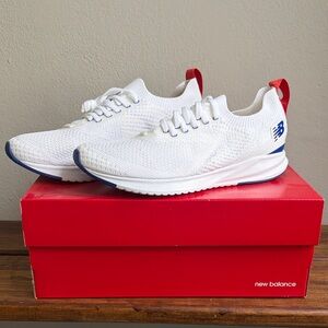 New Balance White Knit Slip-On Sneakers with Red Pull Tabs and Blue Accents